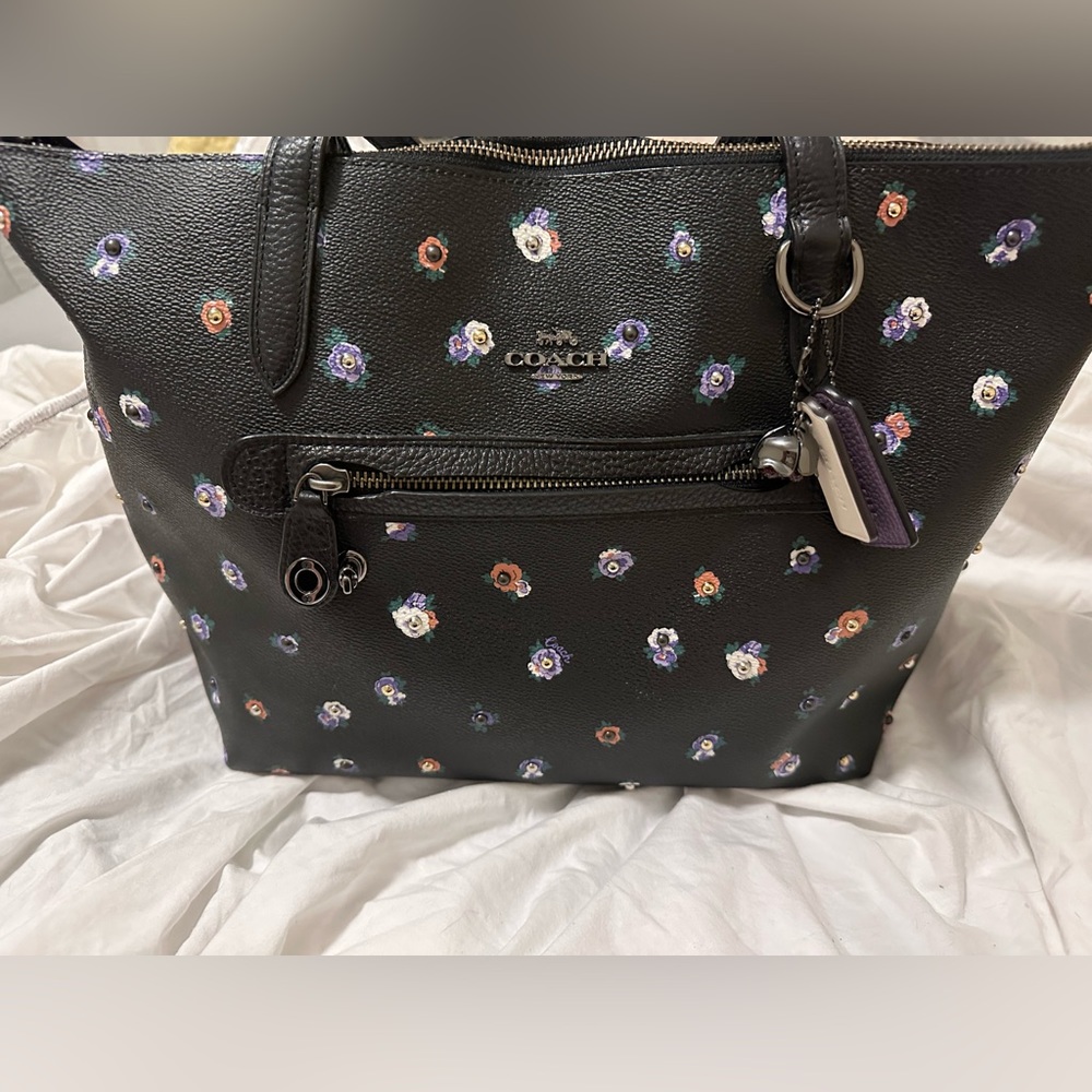 Brand new one of a kind coach purse receipt, and dust bag included.